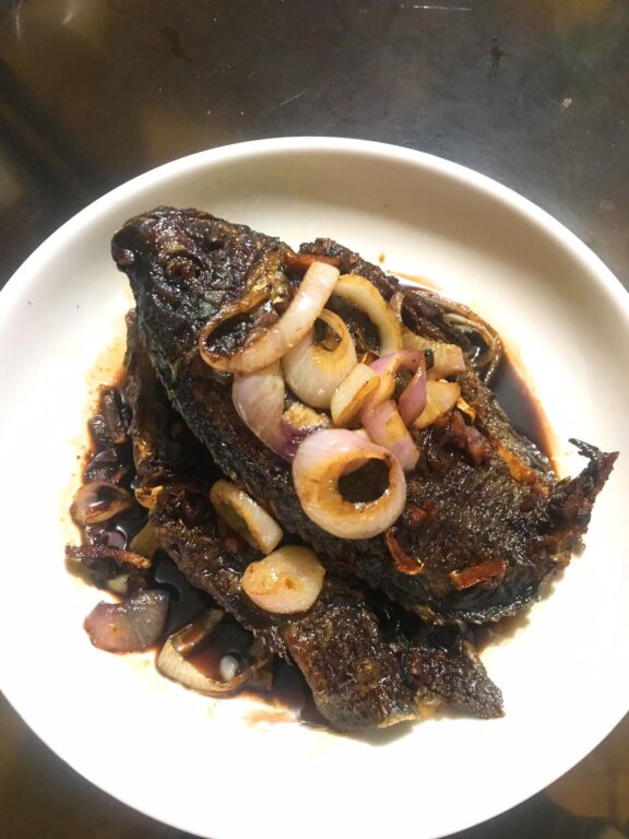 Fried Tilapia mixed with an experimental steak sauce by Jay Quilanita