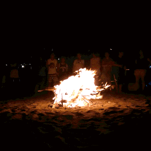 We gathered around the bonfire by the beach