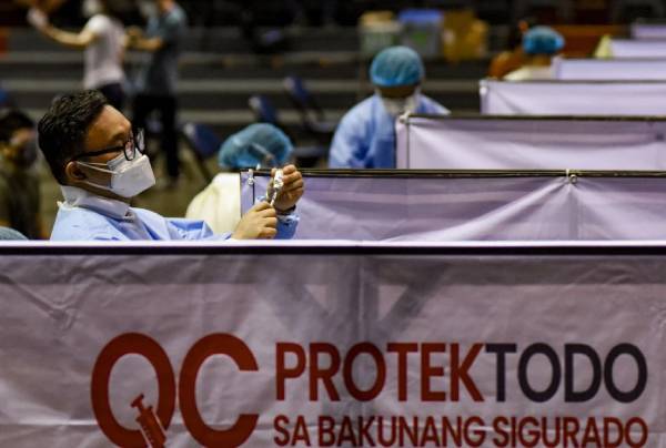 Quezon City gov’t, BPO groups sign deal to ‘expedite’ inoculation of 67K employees